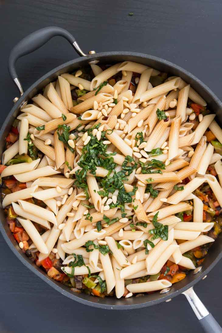 Overhead photograph of pasta with veggies. This is a step by step on how to make pasta.