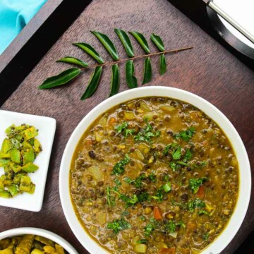 Overhead photograph of curried black lentil soup