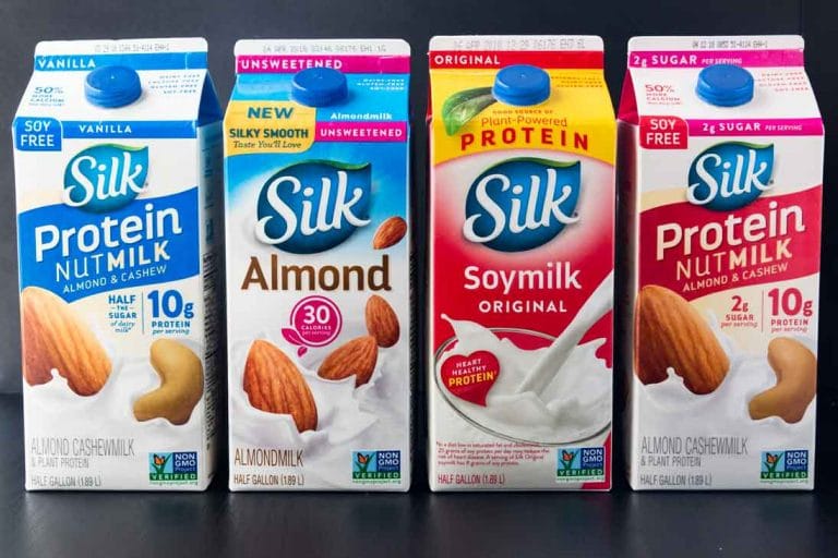 A photograph of four different silk plant-based milks.