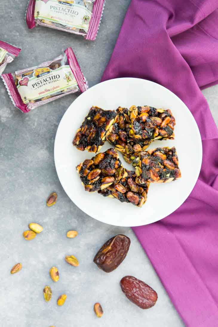 Overhead photograph of pistachio chewy bites for vegan chocolate bars.