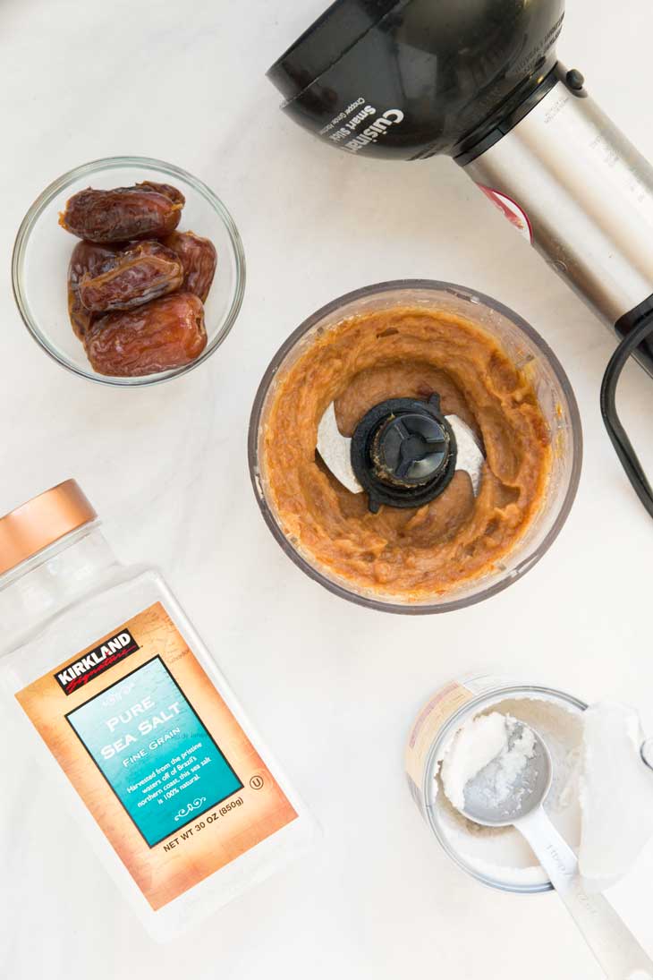 Overhead photograph of the ingredients needed to make date caramel for vegan chocolate bars.