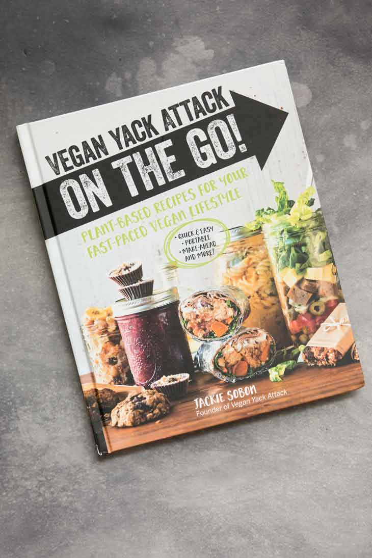 Overhead photograph of a vegan yack attack on the go cookbook containing vegan blt sandwich recipe.