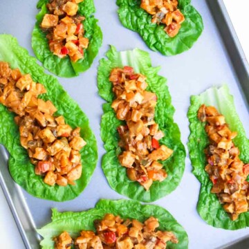 Tofu peanut lettuce wraps on a baking tray