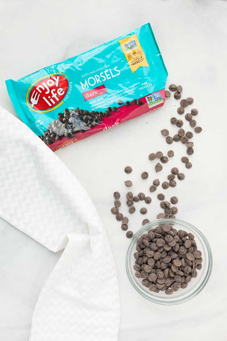 Overhead photograph of vegan chocolate chips from the bag for use to make vegan chocolate pie.