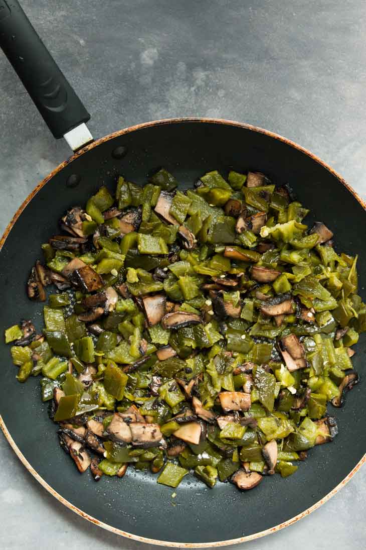 Overhead photograph of mushrooms & poblano peppers for vegan quesadilla.