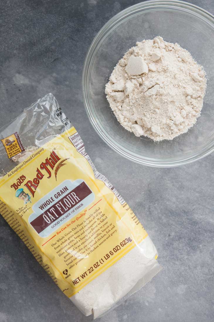 Overhead photograph of Bob's Red Mill Oat Flour in a bowl for vegetable pancakes.