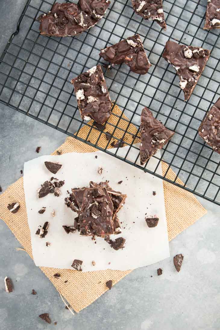 Overhead photograph of pieces of chocolate bark recipe with oreo cookies.